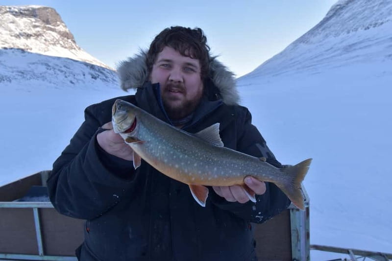 Abisko: Ice Fishing Experience - The first lesson: drilling through the ice
