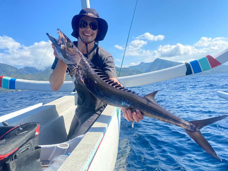 Amed: Private Sunrise Fishing & Catch-and-Cook Experience - A private boat with room for hands-on help