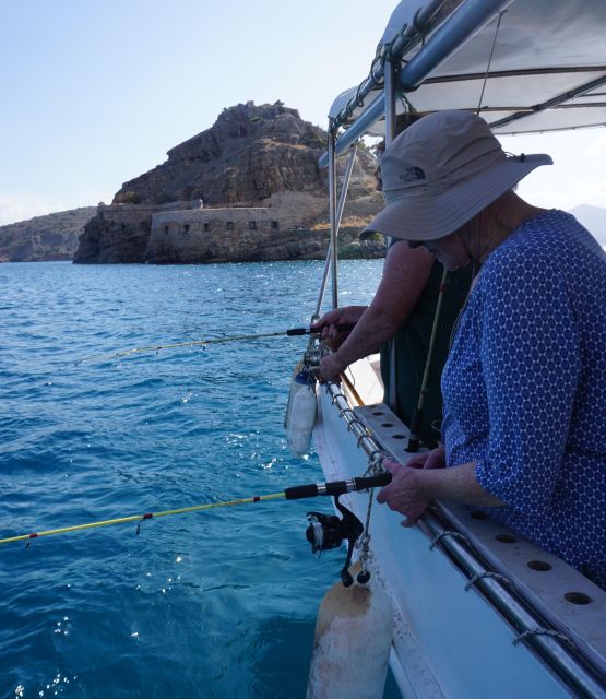 Crete: Fishing & Swimming Boat Cruise with Lunch & Drinks - From hotel pickup to Elounda harbour