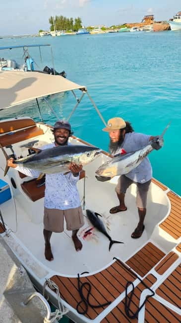 Dhiffushi: Sport Fishing Big Game Fishing Maldives - A shaded boat, clear views, and no swimming stop