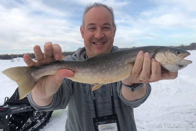 Fairbanks Ice Fishing Expedition in a Heated Cabin with Fish Cookout - Reindeer sausage first, fresh fish after