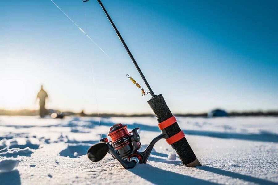 Ice Fishing Adventure in Levi with Salmon Soup - Salmon soup, fire, and a warm wooden shelter