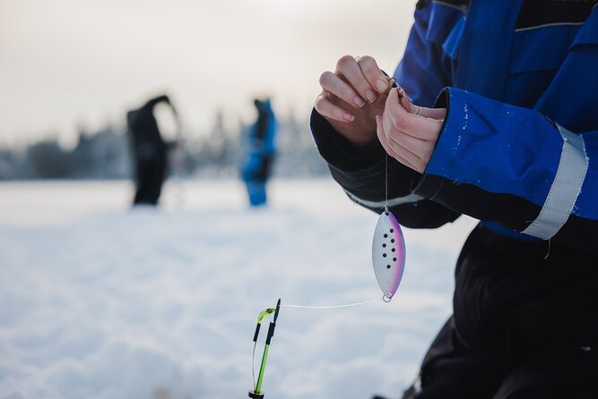 Ice Fishing and Snowmobile Safari Combo in Lapland - Sharing a snowmobile through forest and snow
