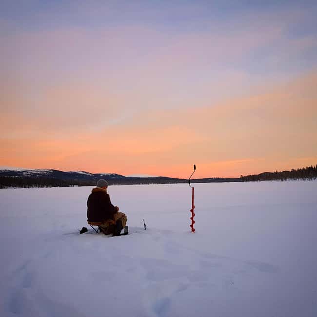 Ice-Fishing by Foot on Lake Ylläsjärvi - Making a hole through one meter of ice