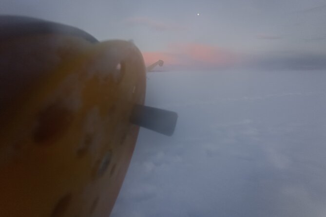 Ice fishing experience with Backpacker Helsinki Tour - The fire-side Finnish meal