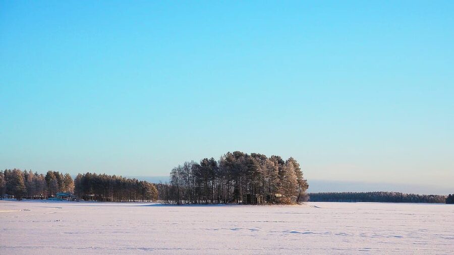 Ice fishing program in Lapland - Fire, Food, and Hot Berry Juice