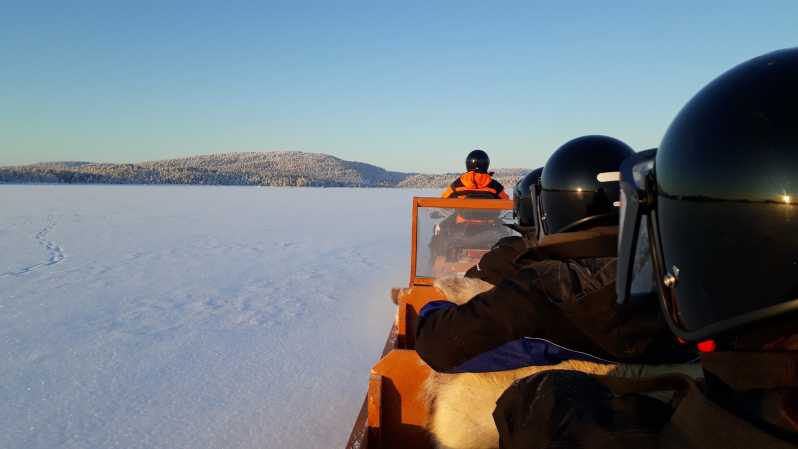 Ivalo: Ice Fishing Tour to Lake Inari, Reindeers & Lunch - Riding a sleigh across the frozen lake