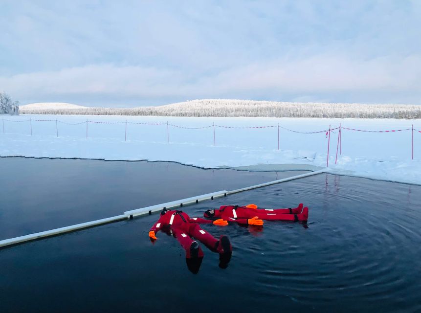 Lapland: Ice Fishing, Floating & BBQ Snow Adventure - Making a Hole in the Frozen Lake
