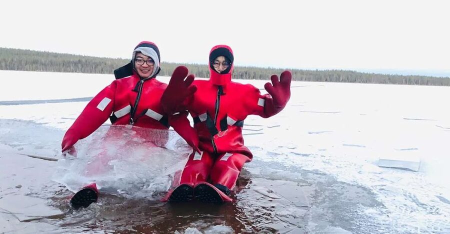 Lapland: Ice Fishing, Floating & BBQ Snow Adventure - Salmon, Lappish Bread, and Firelight
