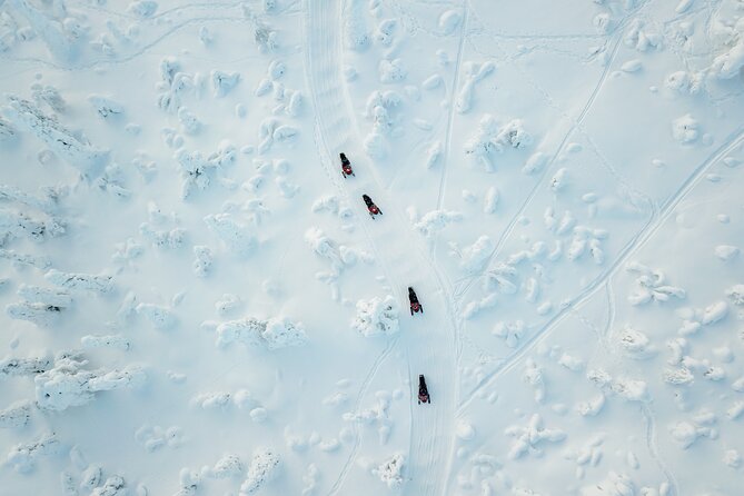Lappish Lunch Break -Snowmobiling, ice fishing and tasty food - A snowmobile route from central Rovaniemi