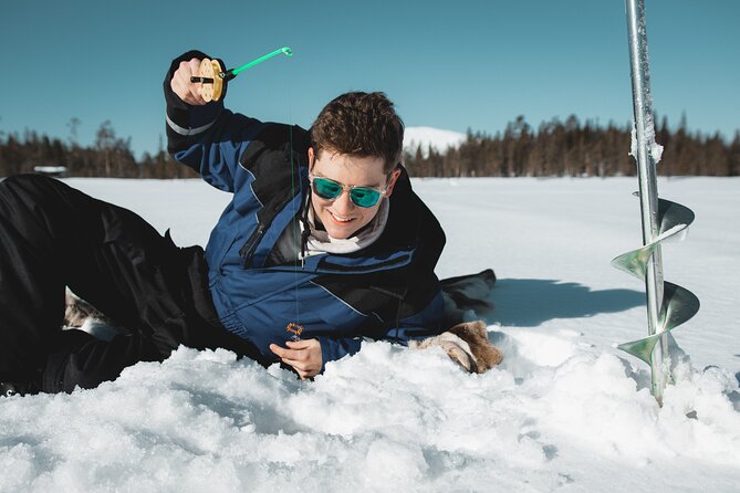 Lappish Lunch Break -Snowmobiling, ice fishing and tasty food - Reindeer soup and a warm break outdoors