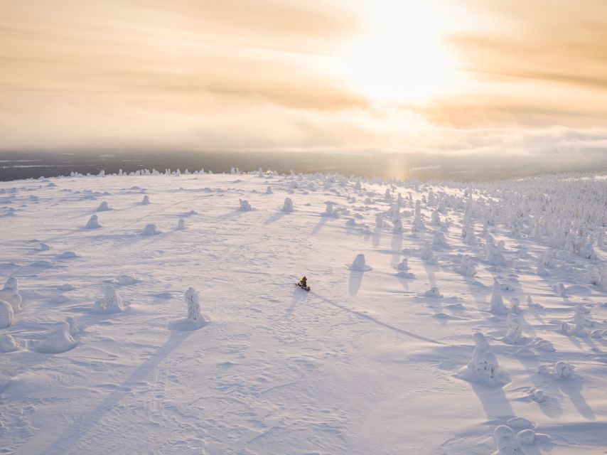 Levi: Ice Fishing by Snowmobile - Riding two by two through snowy forest