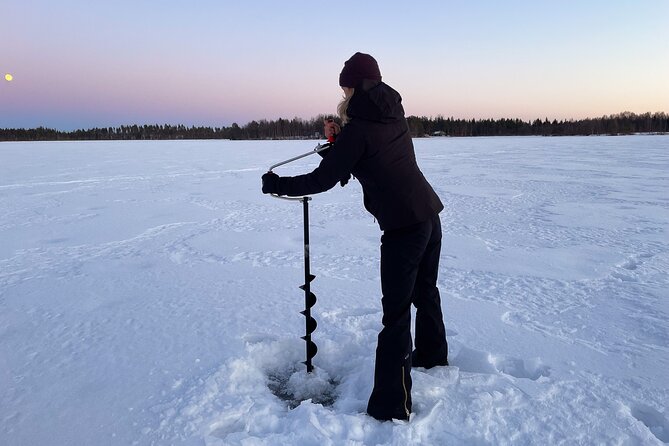 Levi: Small group ice fishing experience - Learning to drill a hole in the ice