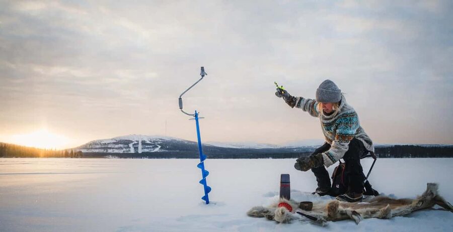 Pyhä: Ice Fishing Experience at Frozen Lake - Drilling the ice and learning the Finnish method