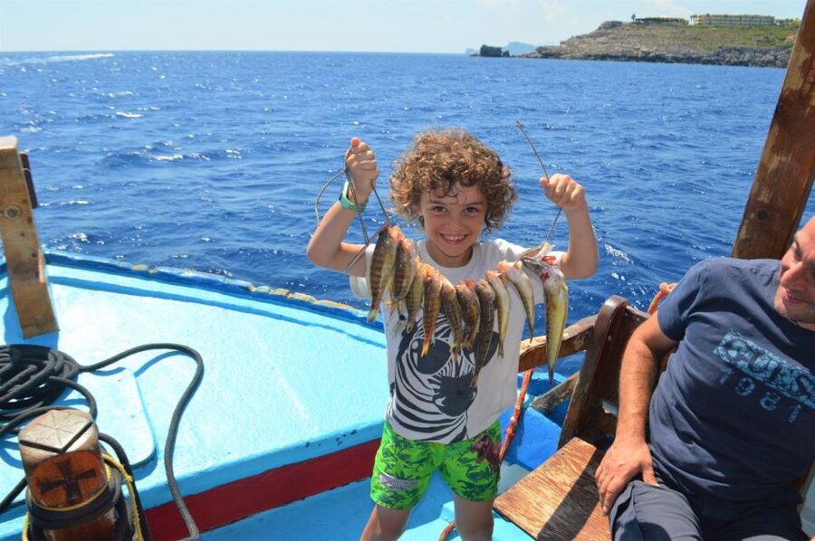 Rhodes Town: Fishing Boat Trip with Fish Meal and Swim Stops - Leaving Mandraki Harbor and seeing Rhodes from the water
