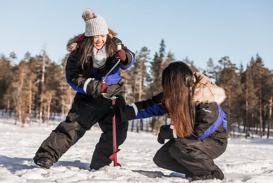 Rovaniemi: Ice Fishing Experience - Drilling through ice, one hole at a time