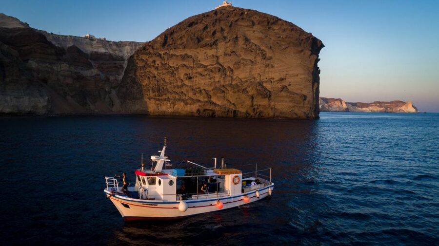 Santorini Sunset Fishing Trip with Dinner and Drinks - Fishing with rods and bait