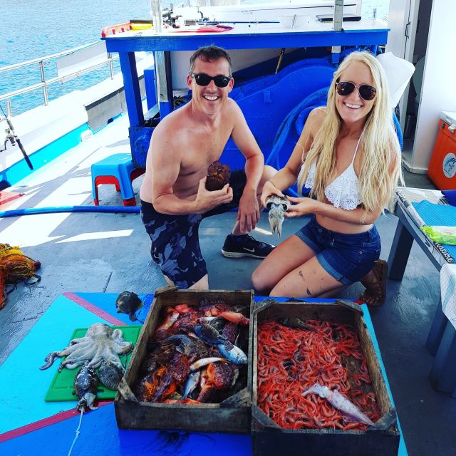 Santorini Sunset Fishing Trip with Dinner and Drinks - Sunset on open water