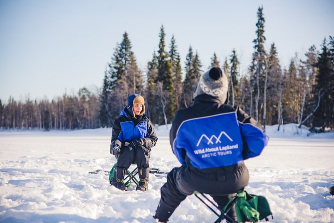 Snowshoeing and Ice Fishing Tour - Drilling through the frozen lake