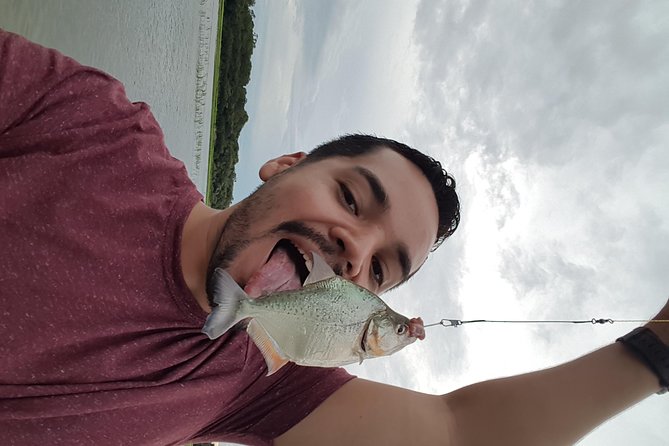 Solimoes River Piranha Fishing and Alligator Watching Tour - Fishing for piranhas near Iranduba