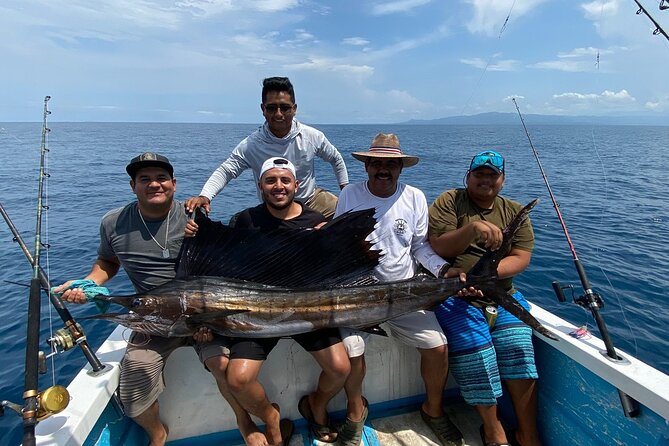Sport Fishing Adventure in Puerto Vallarta - Fishing beneath Puerto Vallarta’s jungle-covered mountains