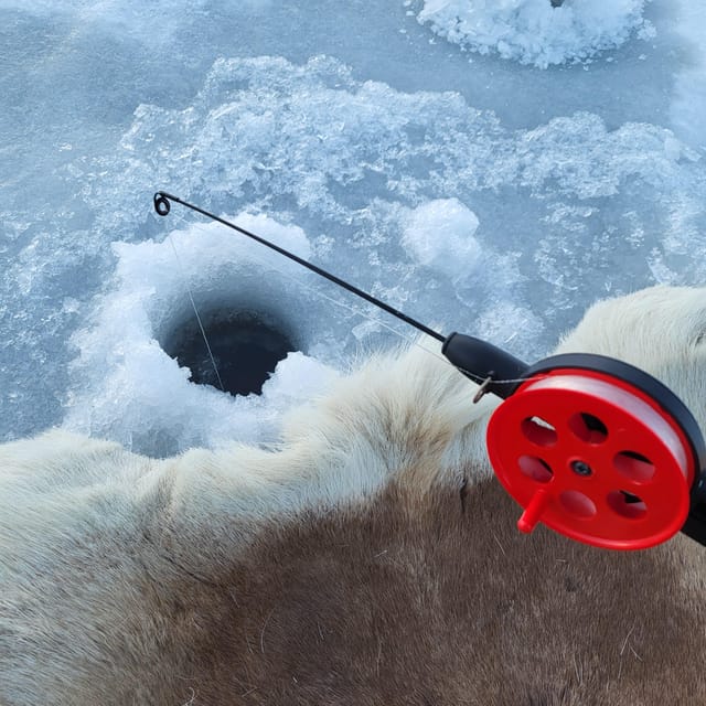 Tromsø: Ice Fishing and Snowshoe Hiking with a Local Guide - Drilling holes and learning ice fishing